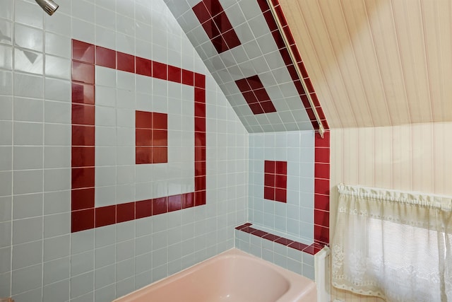 bathroom featuring lofted ceiling