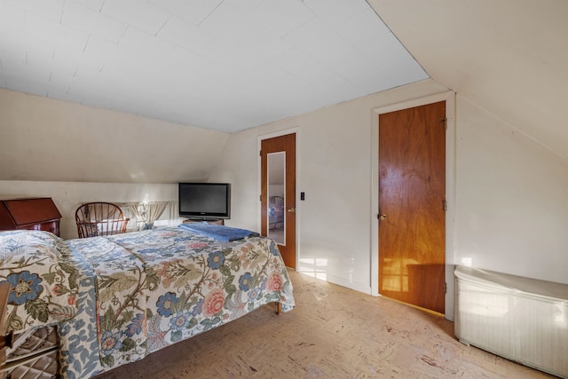 bedroom with vaulted ceiling