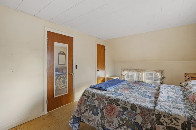 bedroom featuring vaulted ceiling