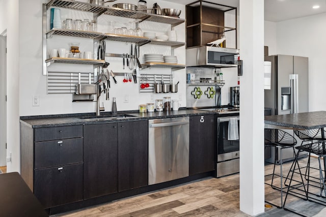 kitchen featuring light hardwood / wood-style floors, sink, and stainless steel appliances