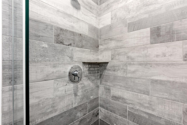 room details with a tile shower