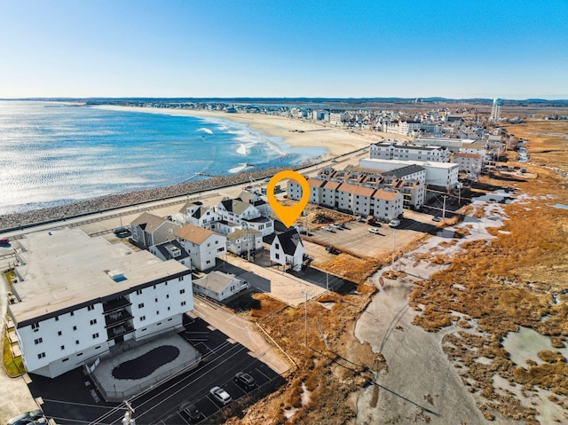 aerial view featuring a water view and a beach view