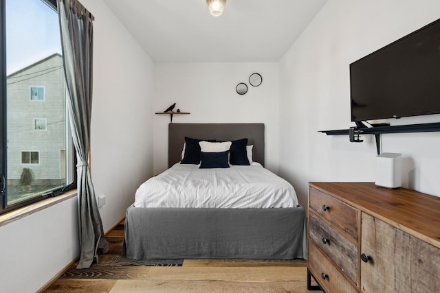 bedroom with light hardwood / wood-style flooring