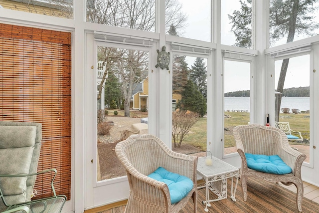 sunroom with a water view