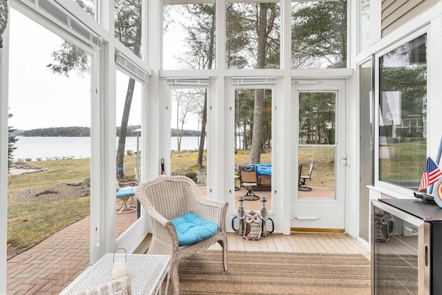 sunroom with a water view