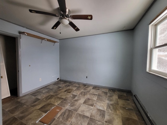 unfurnished room featuring baseboard heating and ceiling fan