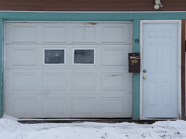 view of snow covered garage