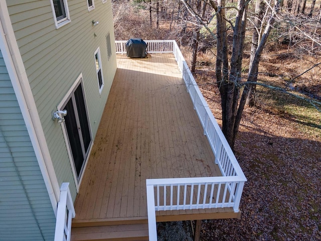 wooden terrace featuring area for grilling