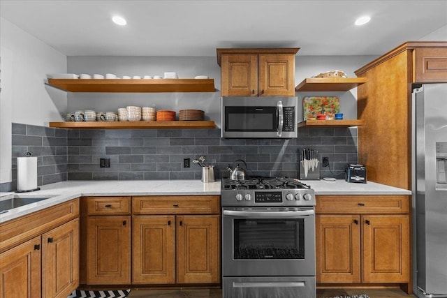 kitchen featuring light stone countertops, backsplash, and stainless steel appliances