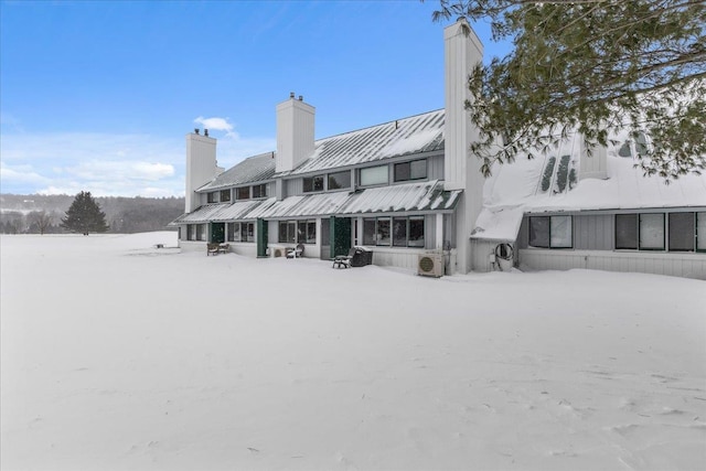 view of snow covered house