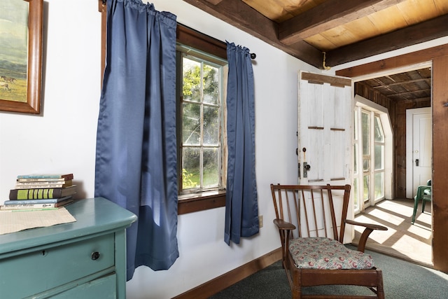 61 Crosby Rd, Topsham, VT 05076 - sitting room featuring beamed ceiling, carpet flooring, wood walls, and wooden ceiling
