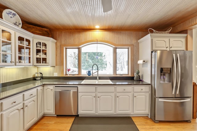 kitchen featuring white cabinets, appliances with stainless steel finishes, and sink