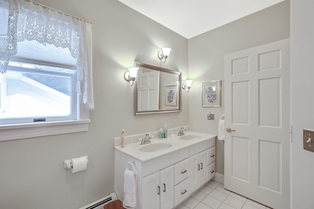 bathroom featuring tile patterned flooring, vanity, and a baseboard radiator