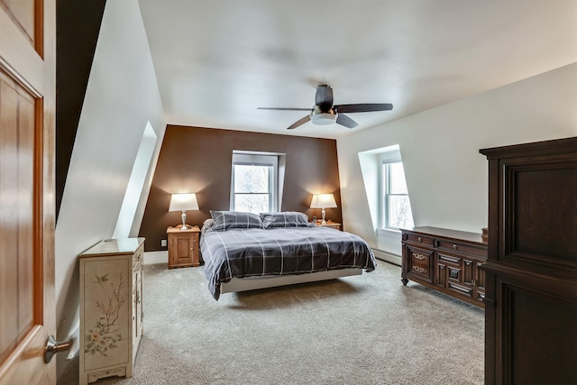 carpeted bedroom featuring ceiling fan and a baseboard radiator