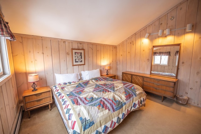 bedroom featuring carpet flooring, a baseboard radiator, and vaulted ceiling