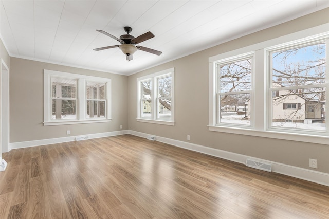 empty room with light wood-type flooring and ceiling fan