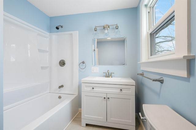 full bathroom with tile patterned floors, toilet, vanity, and washtub / shower combination