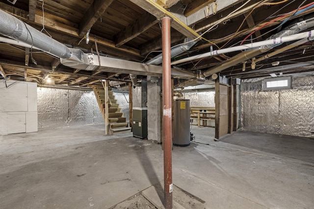 basement featuring heating unit and water heater