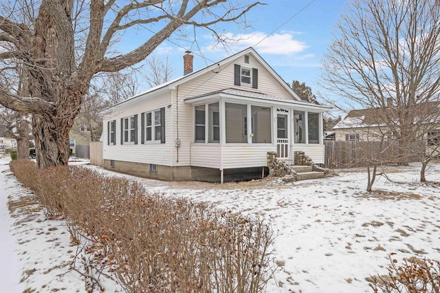 view of front facade featuring a sunroom