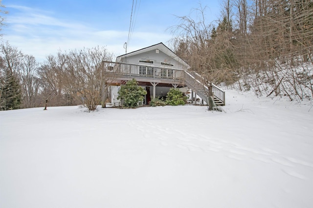 view of front of property with a wooden deck