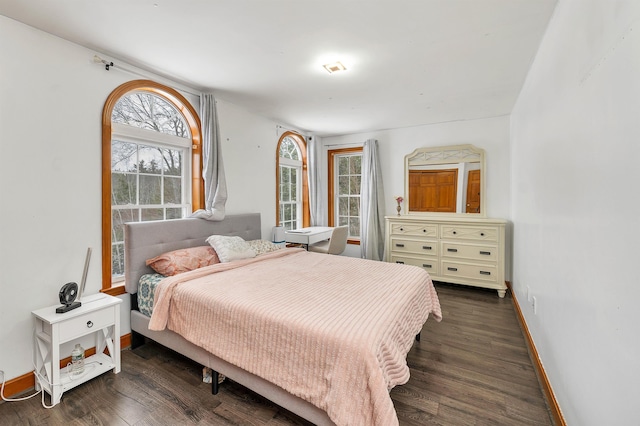 bedroom featuring dark hardwood / wood-style flooring