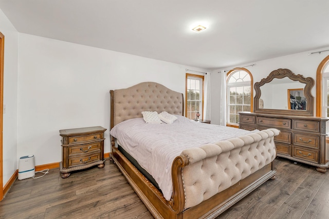 bedroom featuring dark hardwood / wood-style flooring