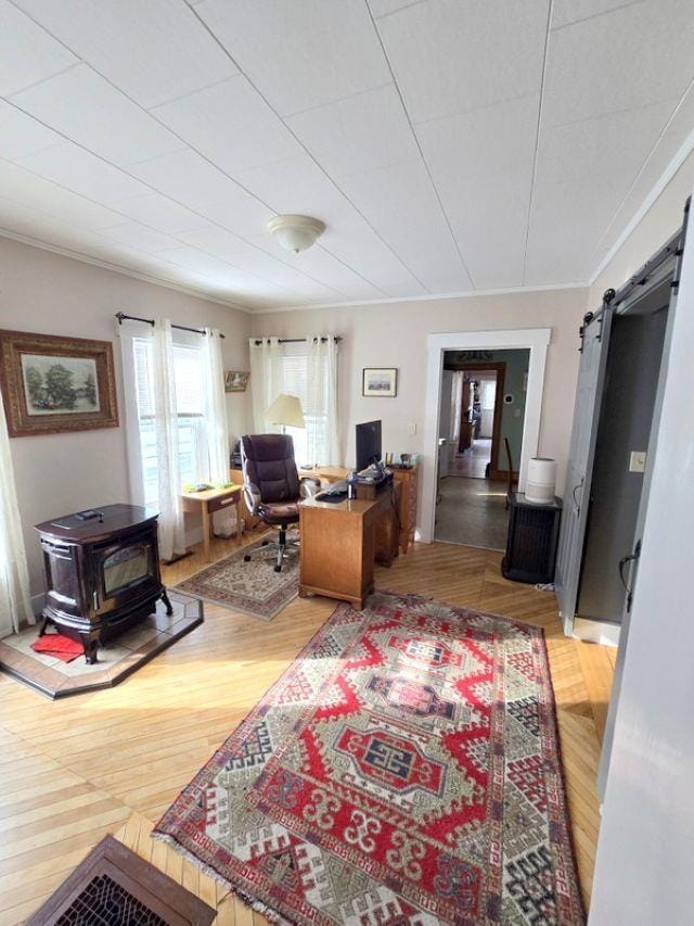 office space with ornamental molding and hardwood / wood-style floors