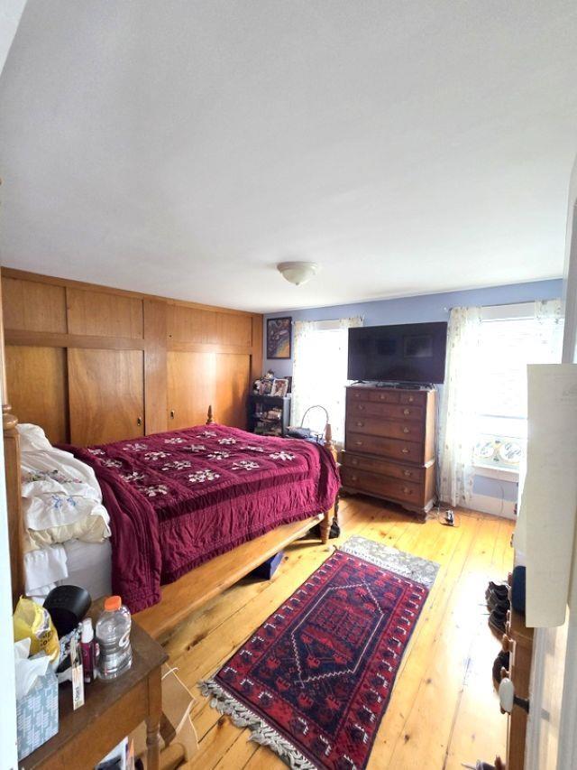 bedroom with light wood-type flooring