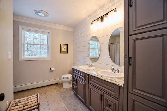 bathroom featuring tile patterned floors, vanity, crown molding, a baseboard radiator, and toilet