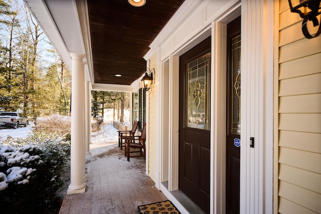 view of snow covered property entrance