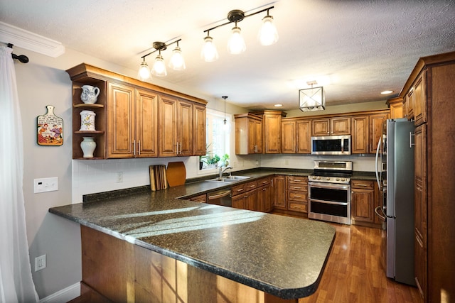 kitchen featuring kitchen peninsula, decorative backsplash, stainless steel appliances, dark wood-type flooring, and decorative light fixtures