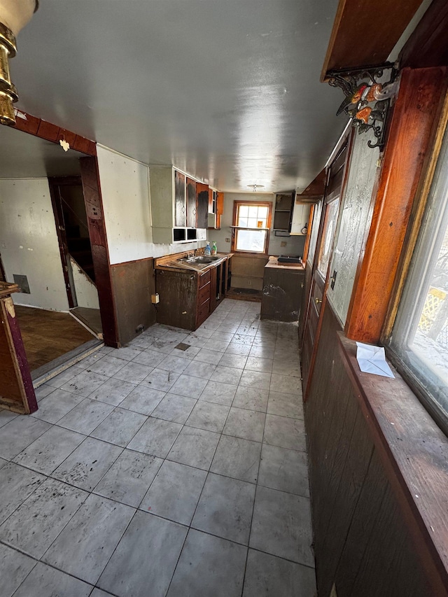 kitchen featuring wooden walls