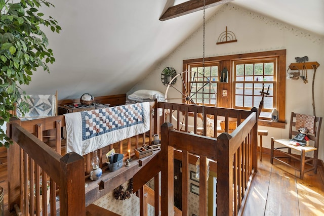 bedroom with hardwood / wood-style flooring and lofted ceiling