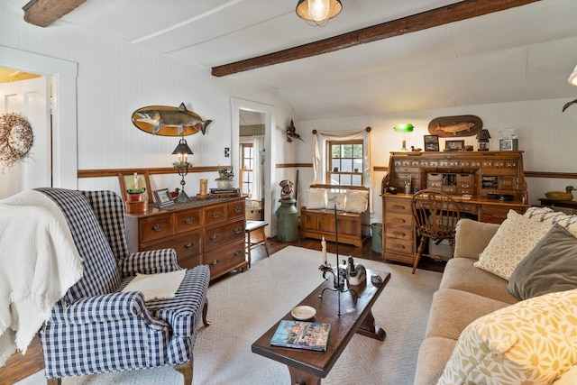 living room with light hardwood / wood-style flooring and lofted ceiling with beams