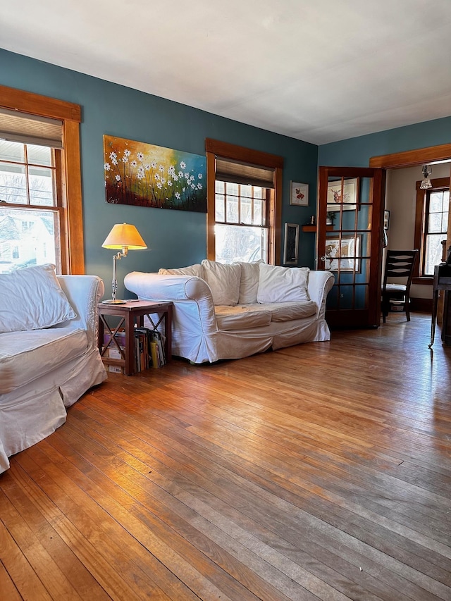 living room featuring a wealth of natural light and hardwood / wood-style flooring