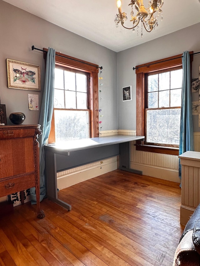 interior space with hardwood / wood-style floors and a notable chandelier