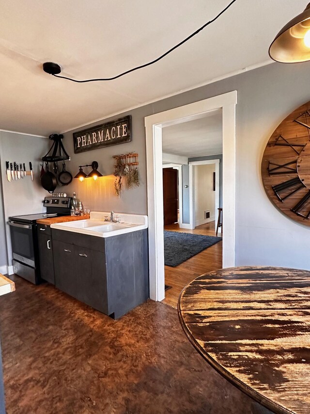 kitchen with sink and stainless steel electric stove