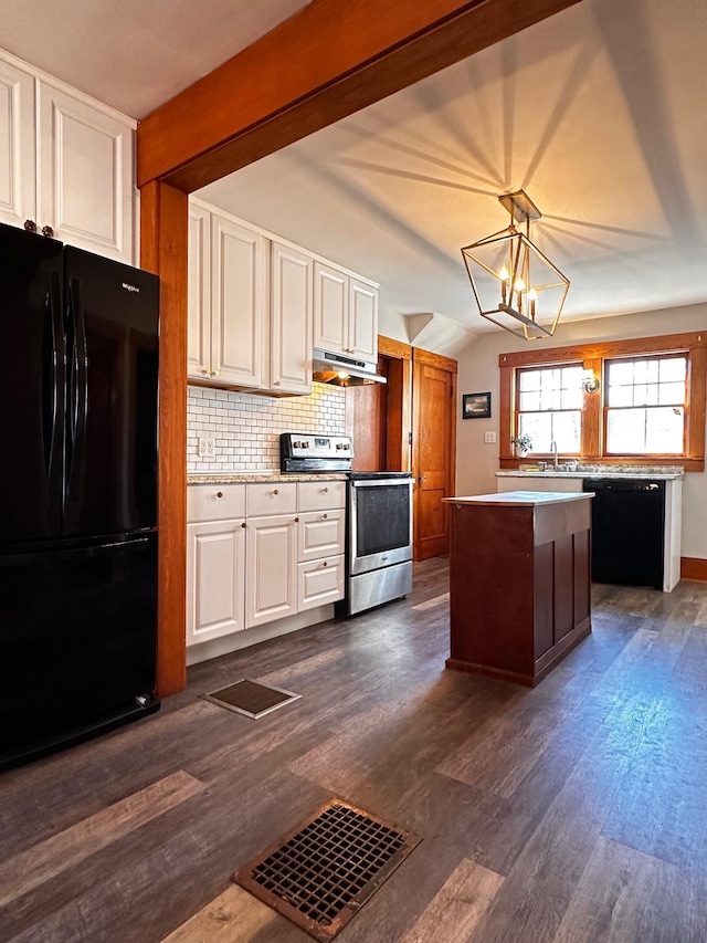 kitchen featuring black appliances, hanging light fixtures, white cabinetry, and a chandelier