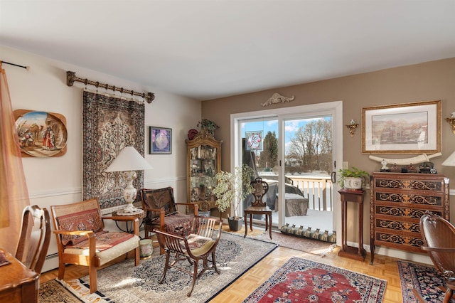 living area featuring a baseboard radiator and light parquet floors