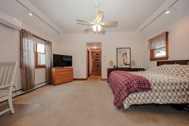 carpeted bedroom featuring a baseboard heating unit, an AC wall unit, rail lighting, and ceiling fan