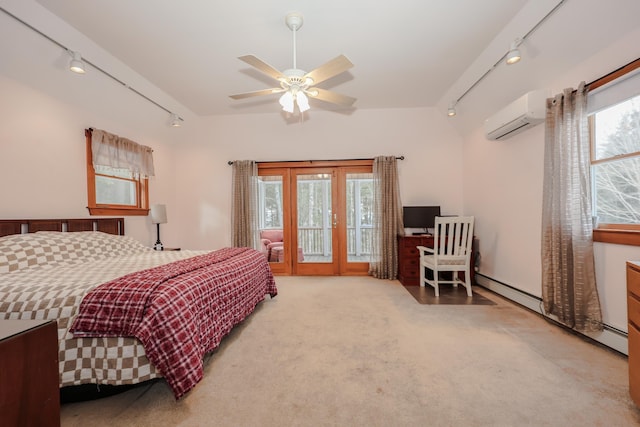 bedroom featuring access to outside, track lighting, light colored carpet, ceiling fan, and a wall mounted air conditioner