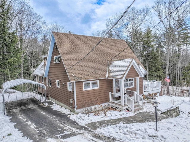 view of front of property featuring a carport