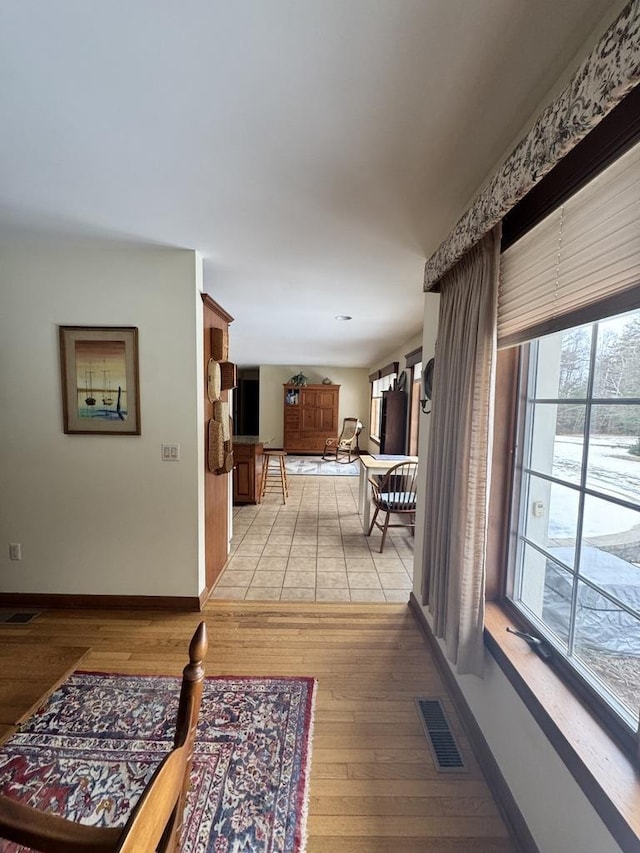 hall with light hardwood / wood-style flooring