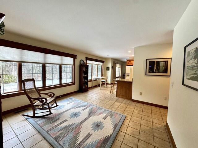 unfurnished living room featuring light tile patterned floors