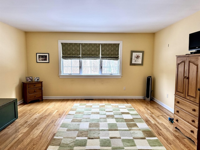 unfurnished bedroom featuring light wood-type flooring