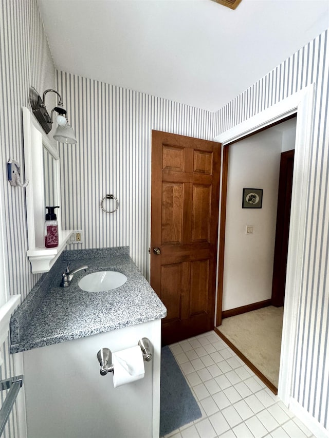 bathroom with tile patterned flooring and vanity