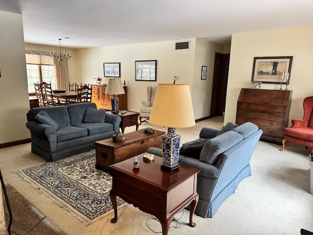 living room with light colored carpet and a chandelier