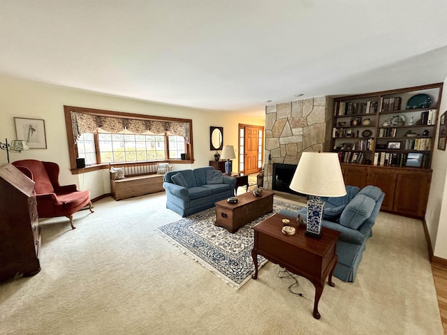 carpeted living room with french doors and a fireplace