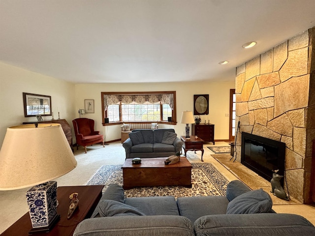 carpeted living room with a fireplace