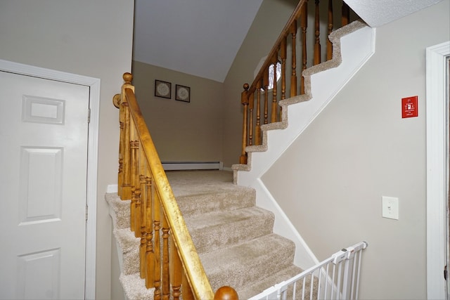 stairs with baseboard heating and carpet floors